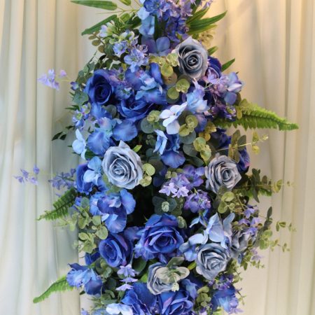 Blue rose and iris casket spray