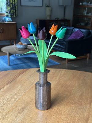 Mixed coloured tulips with "neolist" vase