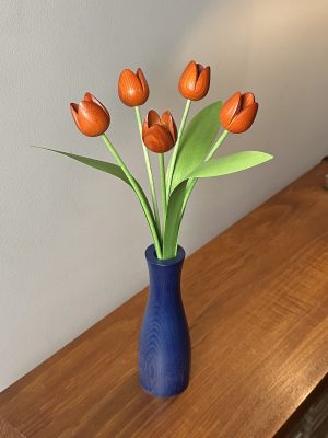 5 orange tulips with blue 'cool' vase