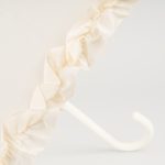 Elegant ivory wedding umbrella with ruffled frill design for special occasions.