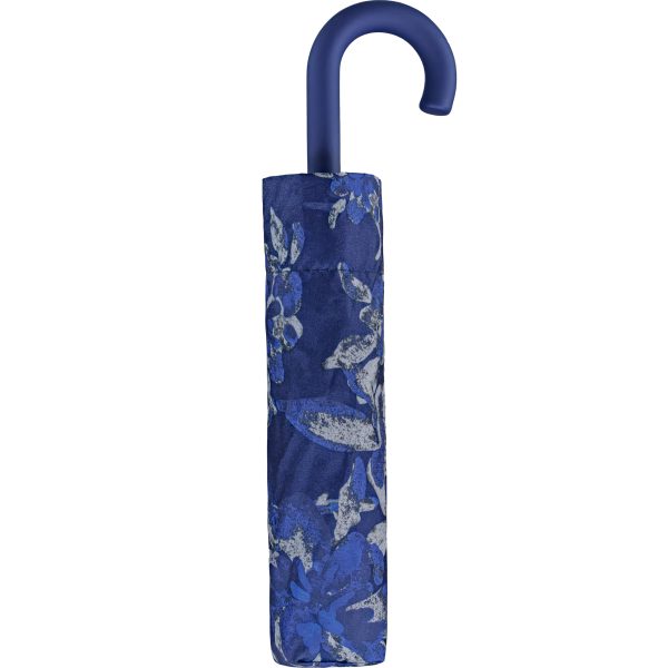 Blue floral patterned crook umbrella for rain protection.
