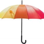Colourful rainbow umbrella with J-shaped handle for walking in rain.