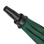 Close-up of green golf umbrella handle with wind-resistant feature.