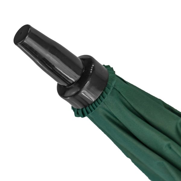 Close-up of green golf umbrella handle with wind-resistant feature.