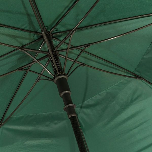 Close-up of a green wind-resistant golf umbrella's frame and canopy.