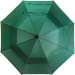 Green wind-resistant golf umbrella for outdoor use.