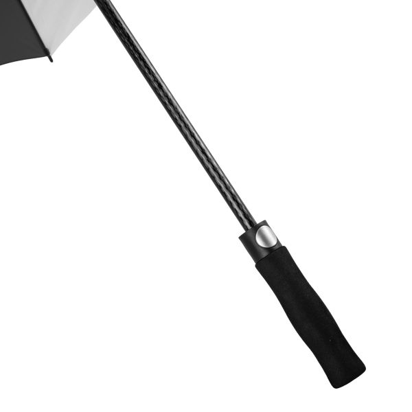 Close-up of black handle and shaft of wind-resistant golf umbrella.