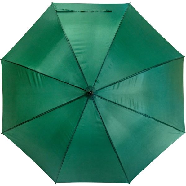 Green wind-resistant Fibrelight golf umbrella for outdoor use.