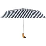 Black and white striped umbrella with wooden handle.