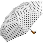 Black and white polka dot umbrella with wooden handle.