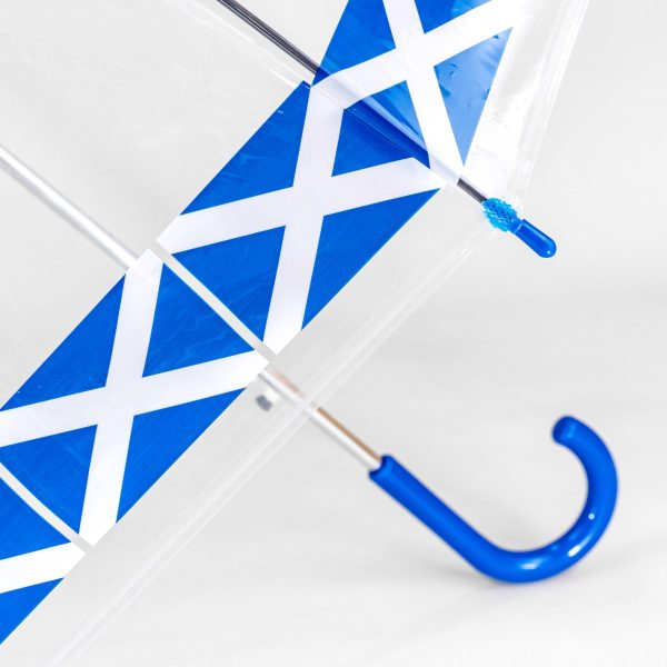 Clear umbrella with blue and white geometric design and blue handle.