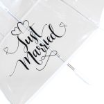 Clear umbrella with 'Just Married' written inside, wedding-themed.