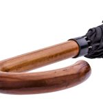 Wooden handle umbrella with black canopy for city walking.