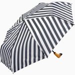 Black and white striped umbrella with duck head handle for stylish protection.